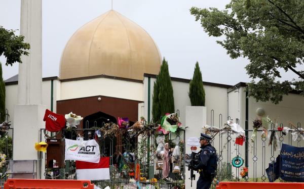 An armed police officer outside Al Noor Mosque in Christchurch, April 2019.